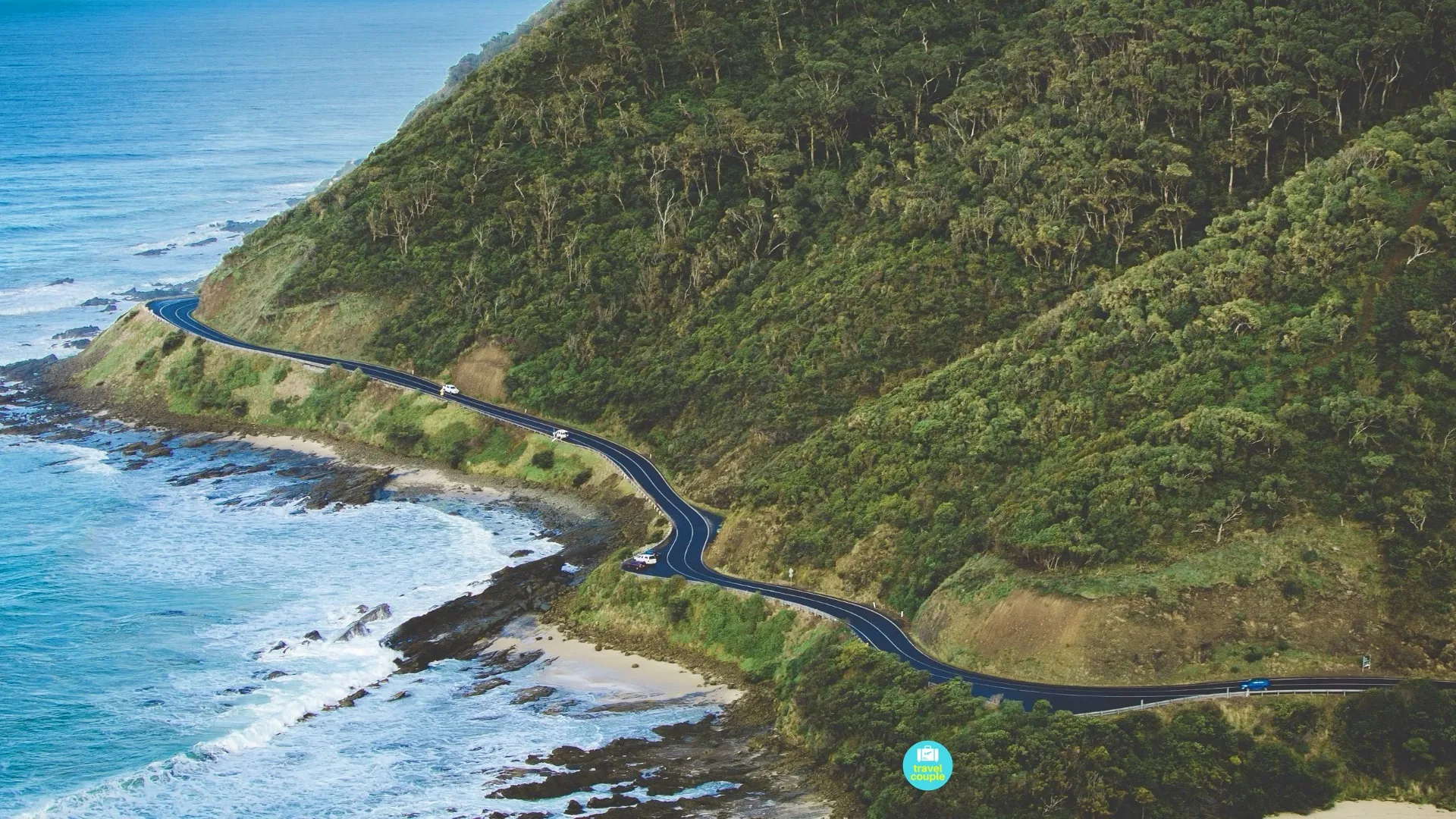 The Great Ocean Road winding between the forest and Southern Ocean